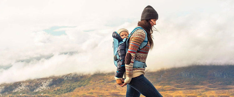 Mom Hiking with Baby in Carrier on Back