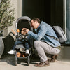 Man Wearing UPPAbaby Changing Backpack with Child in Stroller
