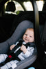 Baby smiling in Clek Liing Safest Infant Car Seat
