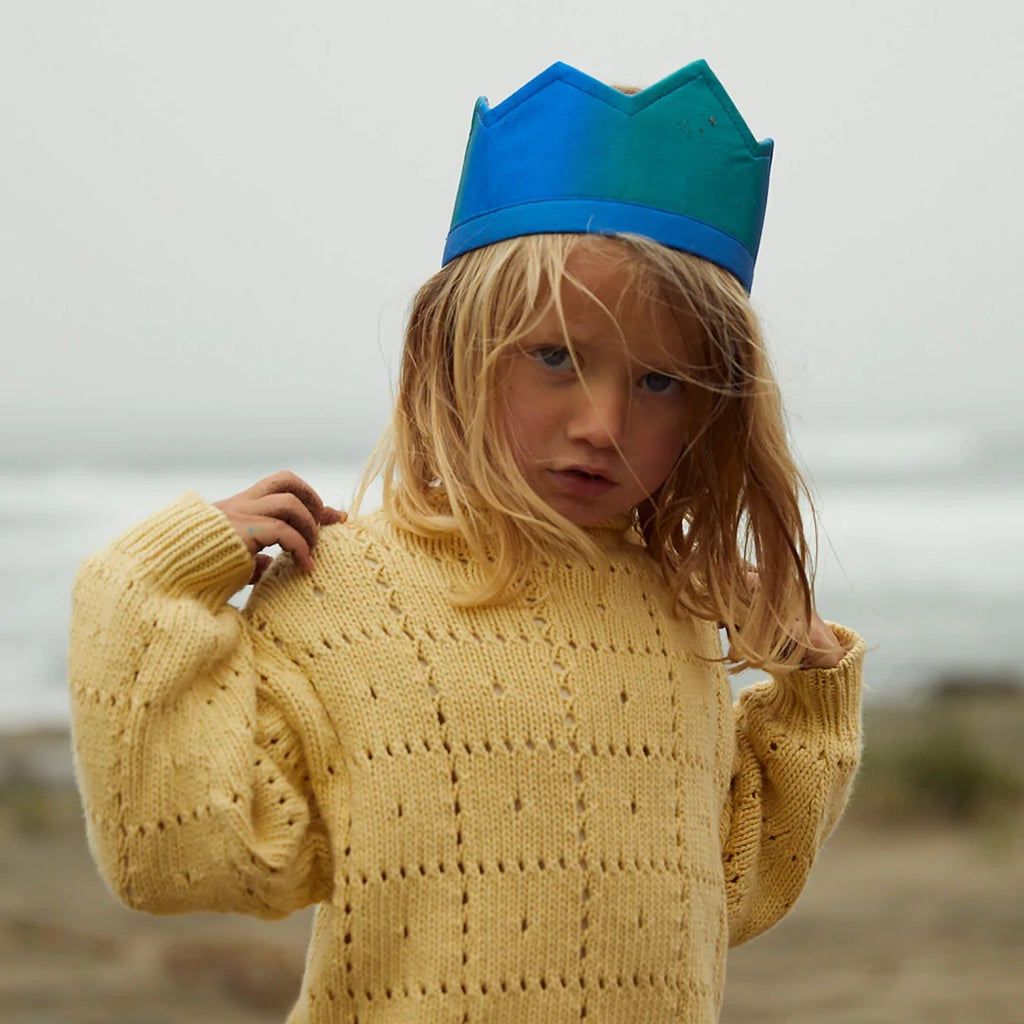 Sarah's Silk Ocean Silk Crown Children's Pretend Dress-Up Crown. Modeled on child with blond hair and yellow sweater outside.