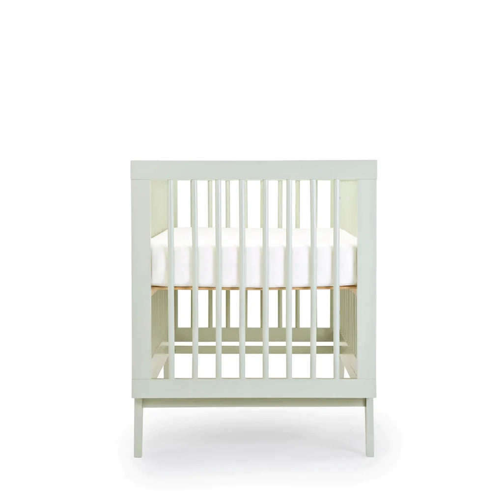 dadada Sage Soho 3-in-1 Convertible Crib to Toddler Bed Furniture. Pastel green in color. Profile view. Baby cribs for sale