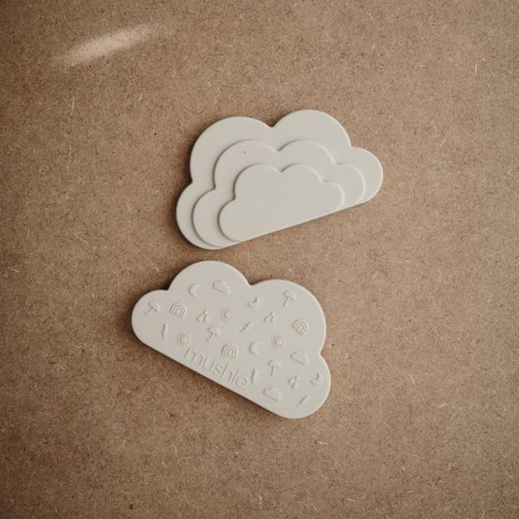 Front and back view of the silicone cloud teether in the shade shifting sand