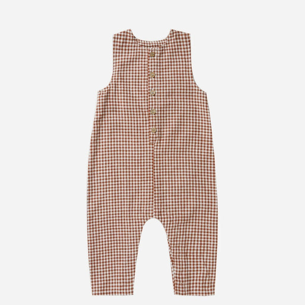 Allow your child to move freely and comfortably in this linen Jumpsuit by Rylee + Cru! This one piece makes putting together an outfit quick and easy while ensuring your little one is comfortable. Red and white checked sleeveless jumpsuit.