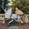 Woman Using Uppababy Cruz Stroller with Bassinet Accessory in Stella
