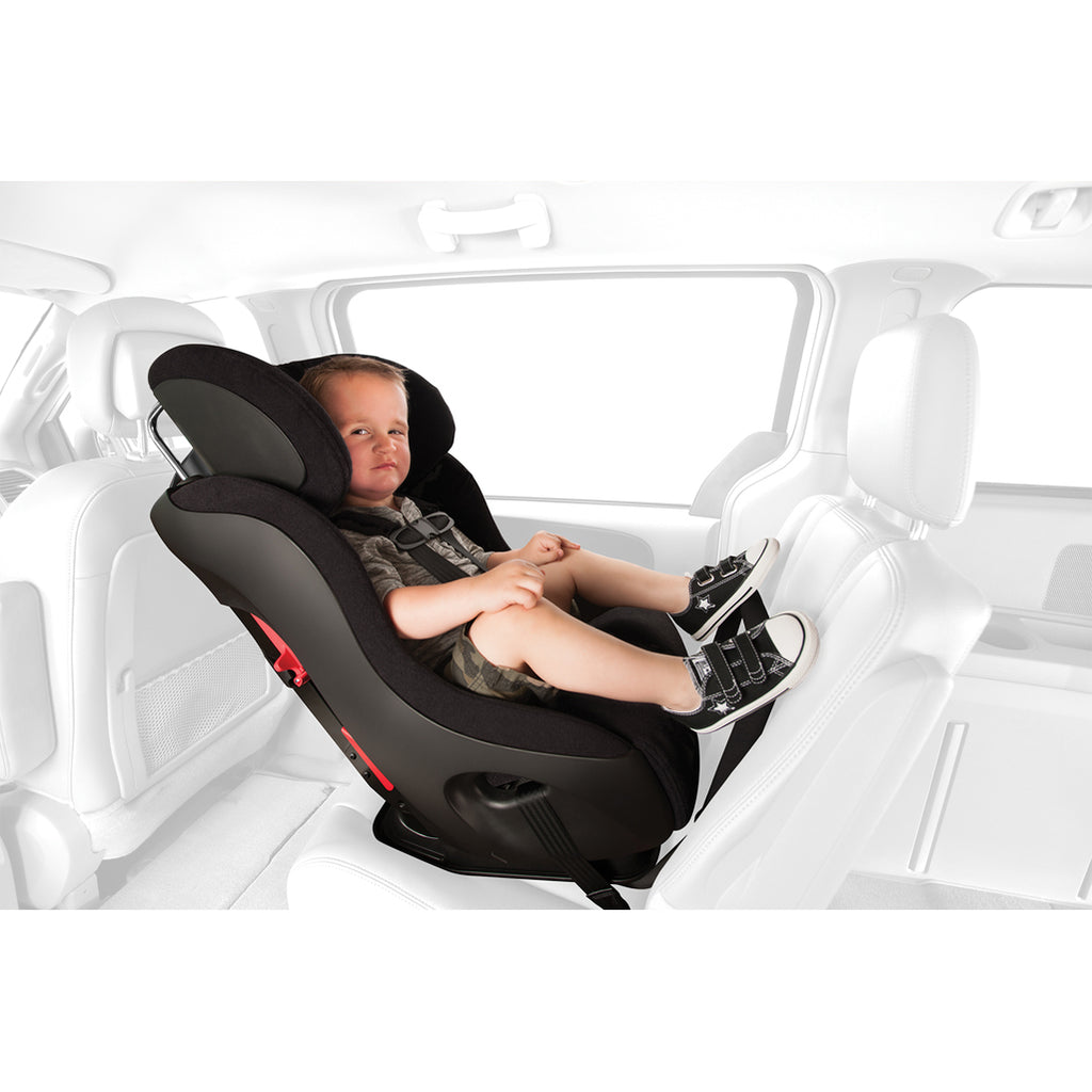 Side view of a child in the Clek Fllo convertible car seat