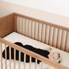 Baby in Crib wearing Kyte Baby Sleep Sack Newborn Sleepwear