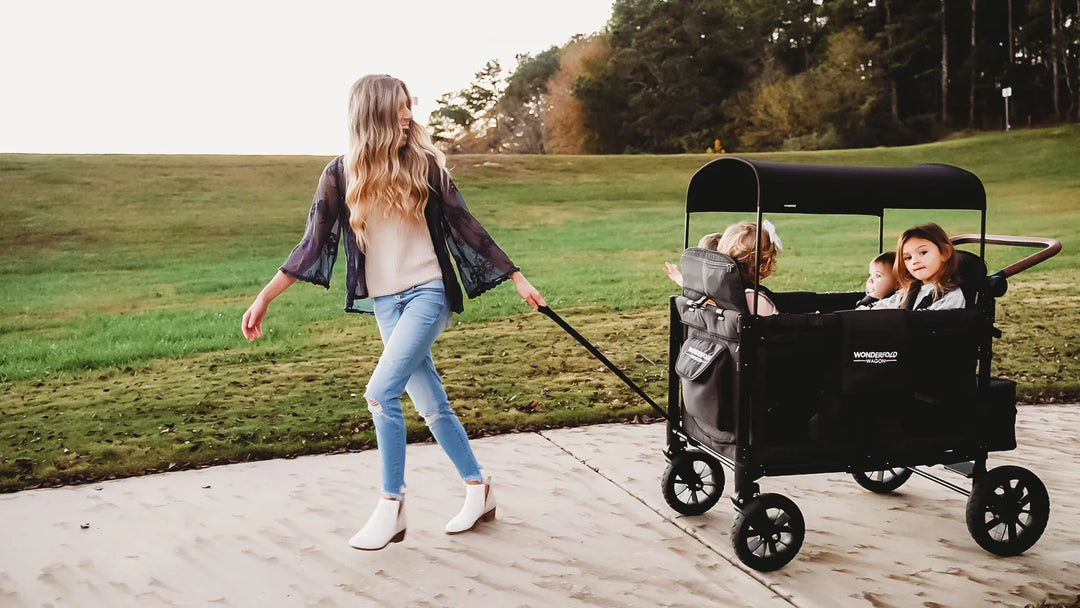 Family with WonderFold Xm4 Four Seater Stroller Wagon