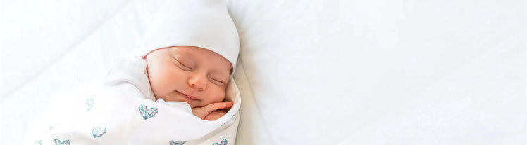 Baby Sleeping with Colored Organics Swaddle