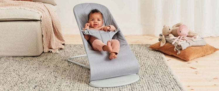 Baby in Grey Infant Bouncer