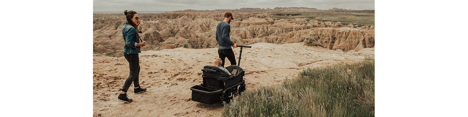 Parents Hiking with Child in Wagon Stroller