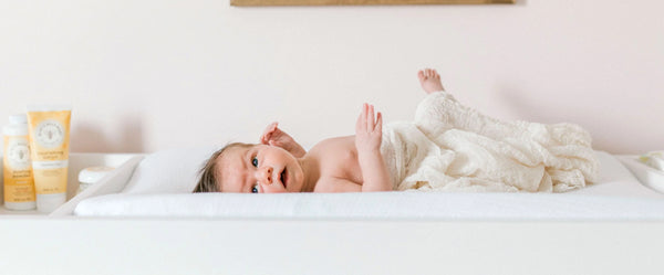 Baby Laying on Changing Table with Blanket