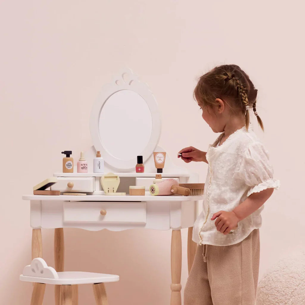toddler playing with le toy van beauty set