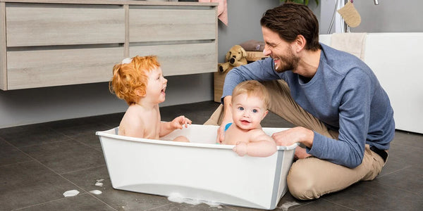 Dad Giving Two Kids a Bath in a Flexibath