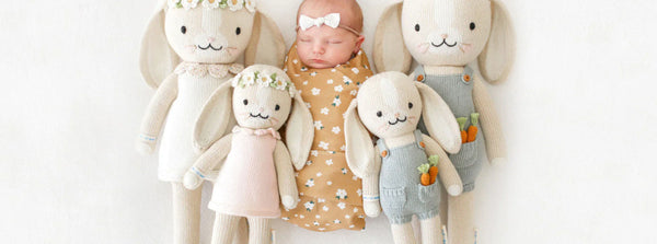 baby with cuddle and kind dolls