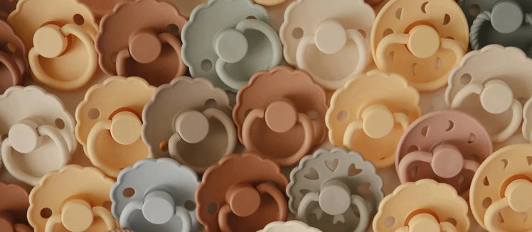 Grouping of Baby Pacifiers in Earthy Colors