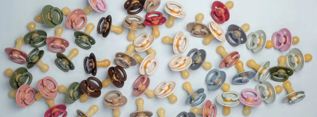 A Collection of Pacifiers on Blue Background