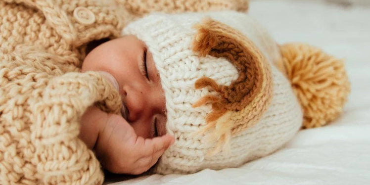 Baby Sleeping in Huggalugs Knit Beanie