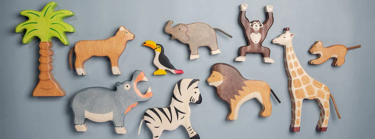 Set of Wooden Zoo Animal Toys on Blue Background