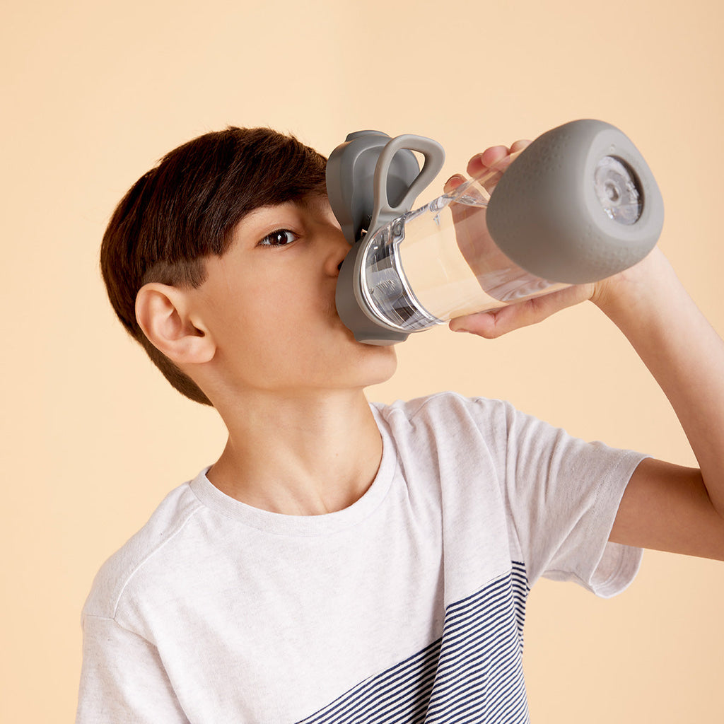boy drinking from b.box sport spout bottle in graphite