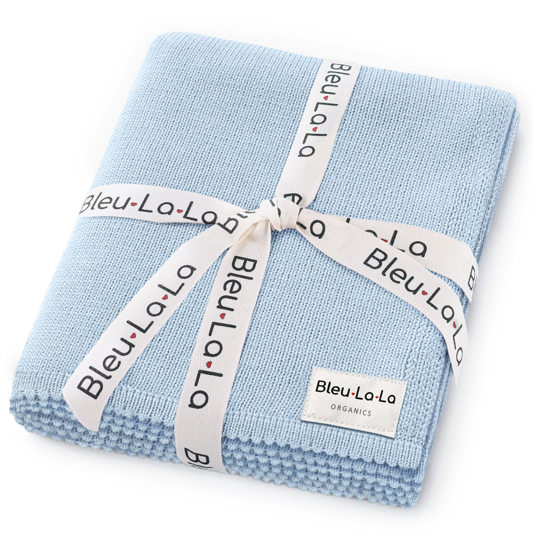 Bleu La La 100% cotton organic luxe baby blanket folded in light blue, soft breathable knit with gift-ready ribbon