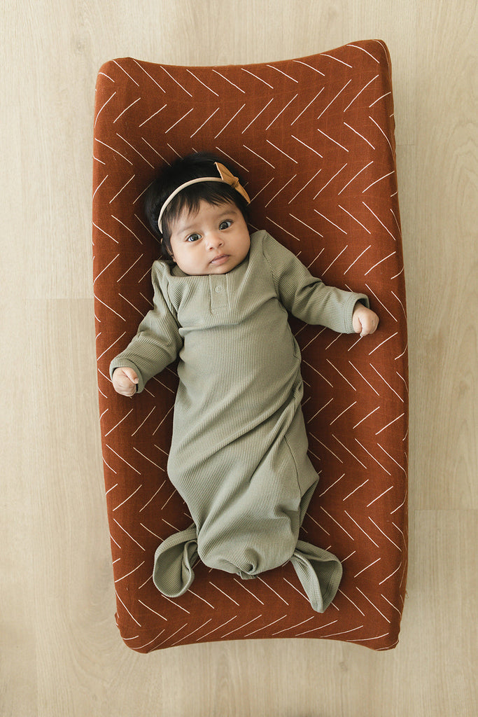 Infant wearing the Mebie Baby cotton knotted gown.