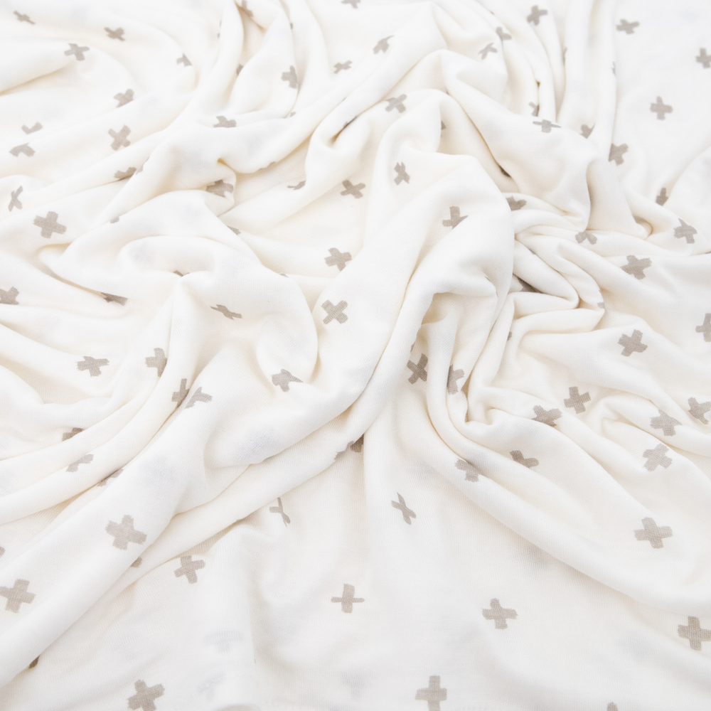 Soft Grey Cross muslin swaddle by Little Unicorn, perfect for gentle infant wrapping and cozy naps