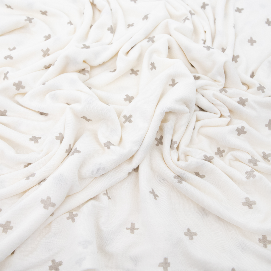 Soft Grey Cross muslin swaddle by Little Unicorn, perfect for gentle infant wrapping and cozy naps