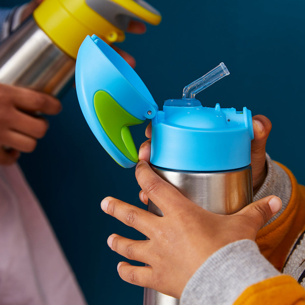 baby holding b.box insulated bottle with parent