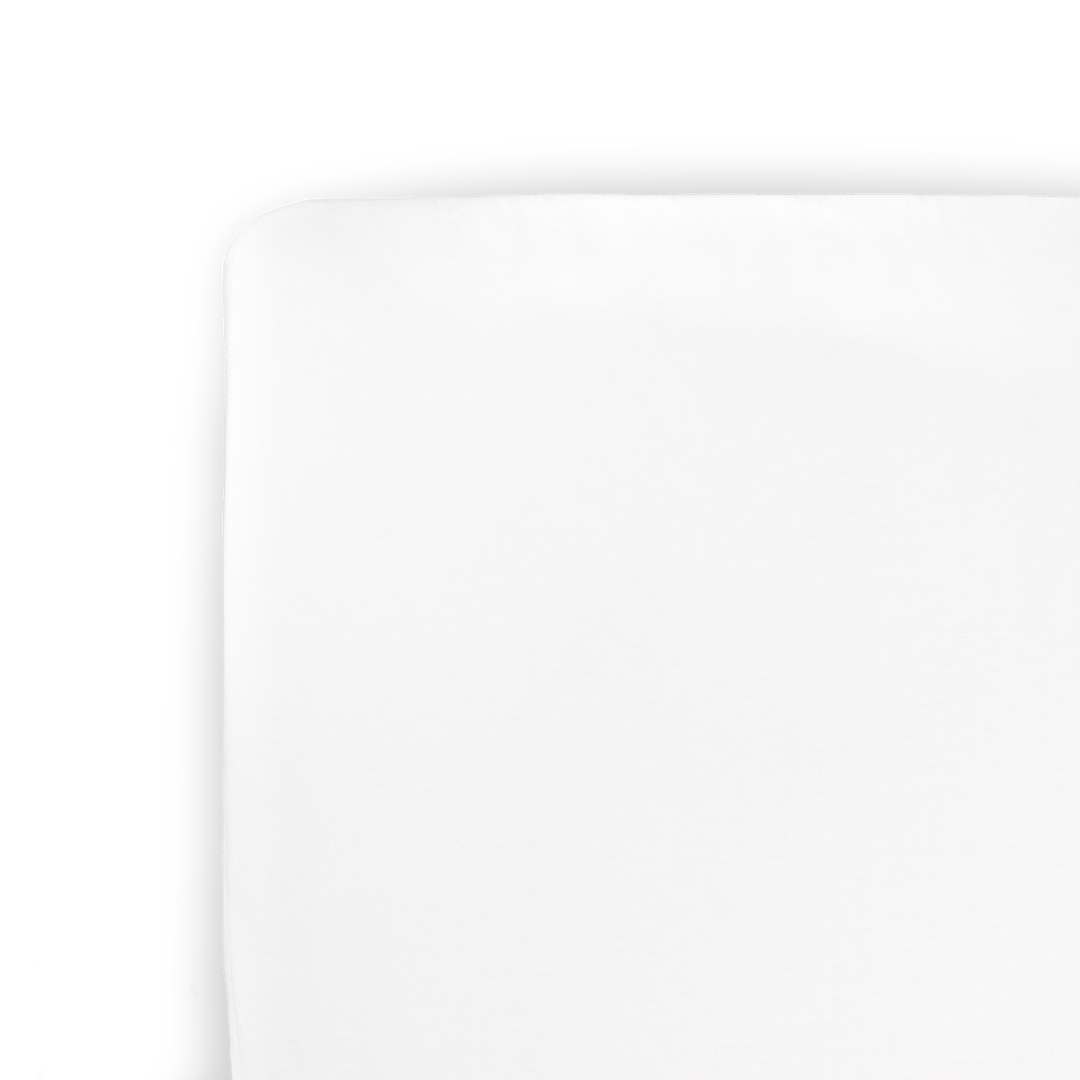 Little Unicorn Stretch Knit Crib Sheet - White on crib mattress, soft fitted crib sheet for baby comfort and nursery style