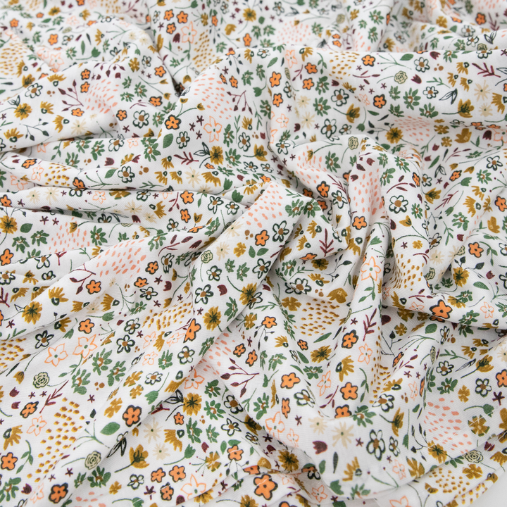 Wrap your baby in comfort with Little Unicorn Pressed Petals Muslin Swaddle, perfect muslin blankets.