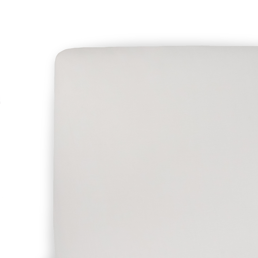 Little Unicorn Stretch Knit Crib Sheet - Pebble on crib mattress, soft fitted crib sheet for baby comfort and nursery style