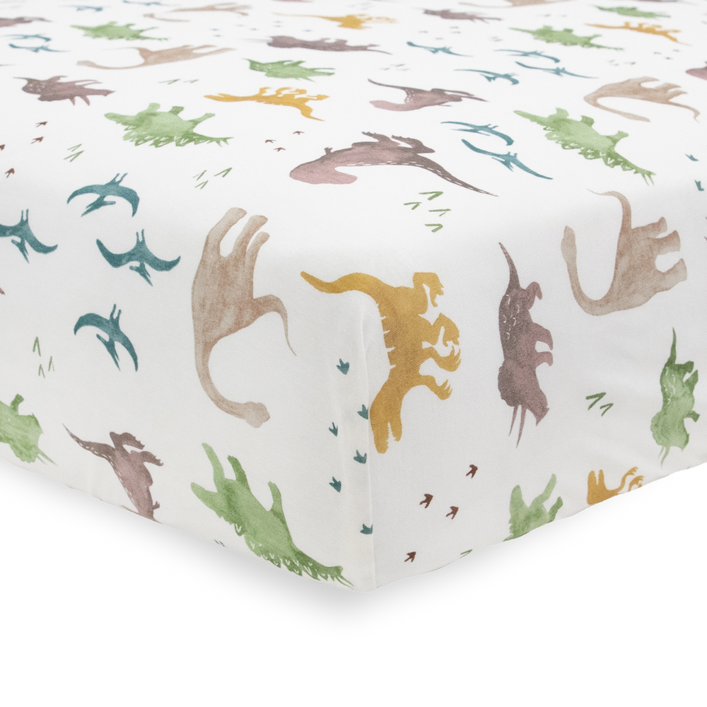 Add comfort with Little Unicorn Stretch Knit Crib Sheet - Dino Pals, organic cotton crib sheets for nursery