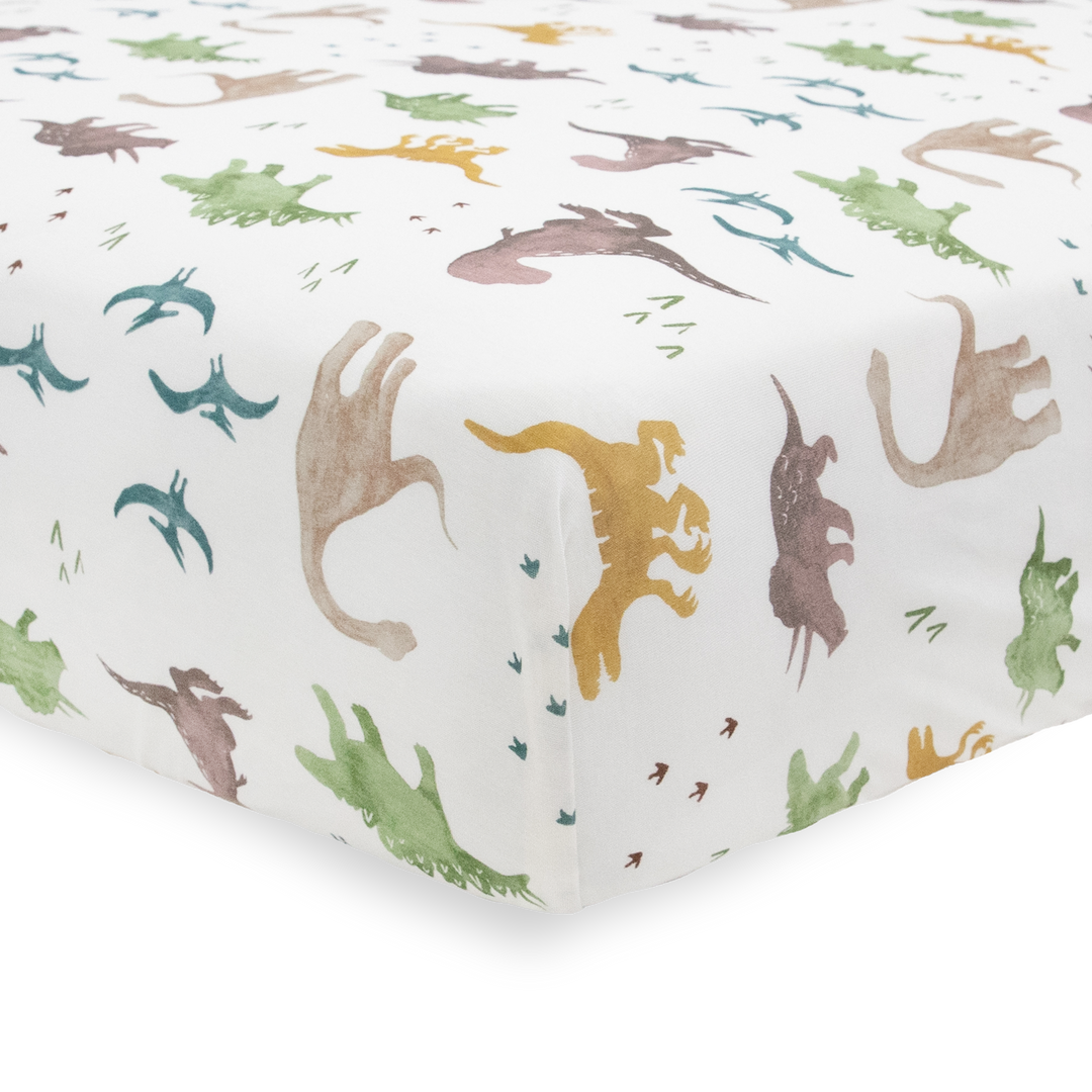 Add comfort with Little Unicorn Stretch Knit Crib Sheet - Dino Pals, organic cotton crib sheets for nursery