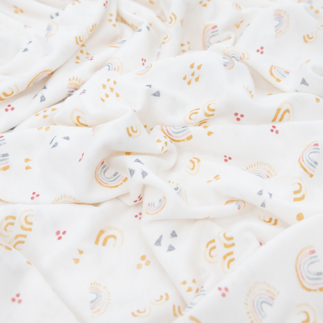 Bright muslin swaddle by Little Unicorn, Stretch Knit Swaddle Blanket 2 Pack - Rainbows, perfect for cozy baby naps