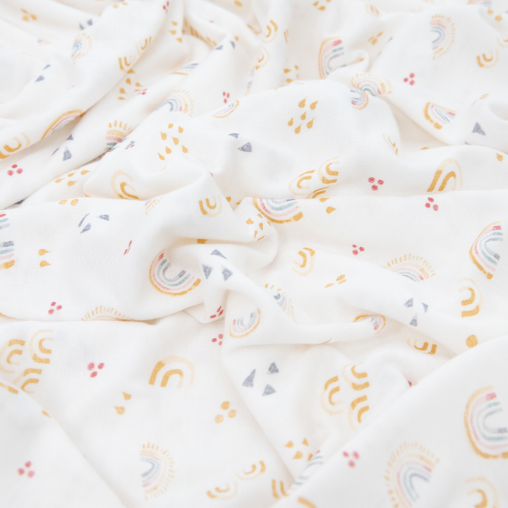 Bright muslin swaddle by Little Unicorn, Stretch Knit Swaddle Blanket 2 Pack - Rainbows, perfect for cozy baby naps