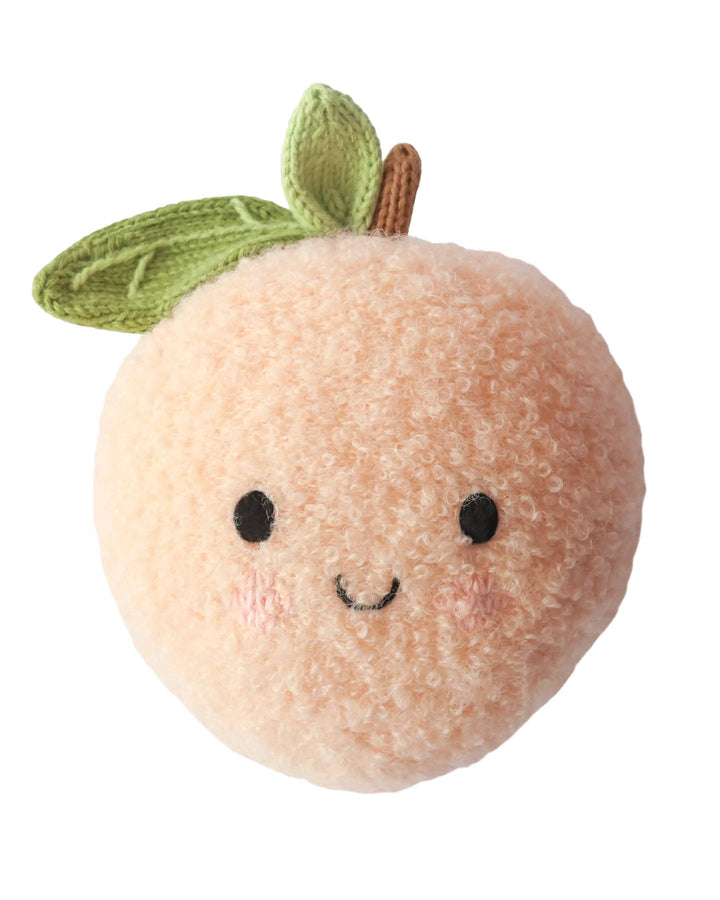 Cuddle + Kind Baby Peach hand-knit fruit plush made with cotton and alpaca yarn, heirloom baby gift