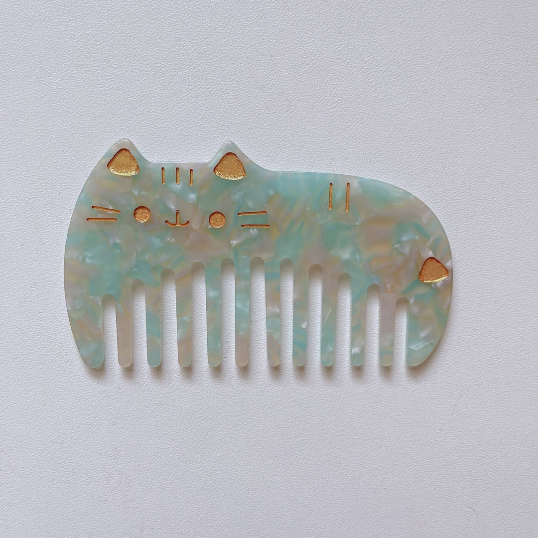 Mint green cat-shaped hair comb by Adorro, playful cat hair accessory and wide tooth detangling comb