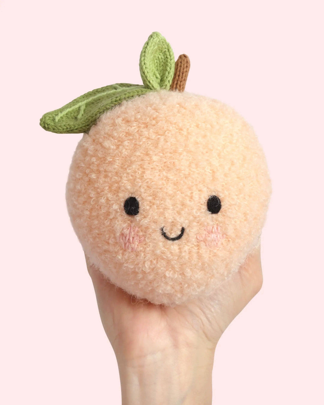 Hand-knit fruit plush toy: Cuddle + Kind Baby Peach, a soft heirloom baby gift