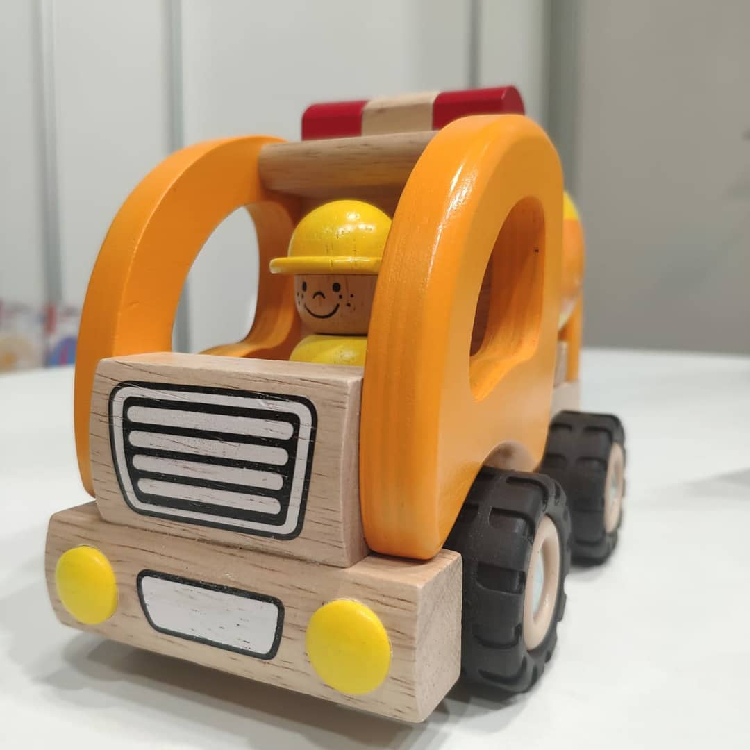 Child-sized wooden construction vehicle with Goki branding