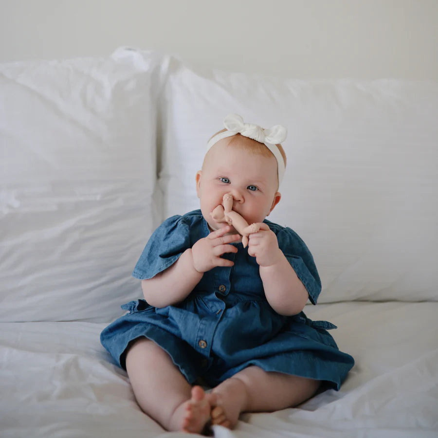 Mushie baby teething toy featuring a unicorn figurine design