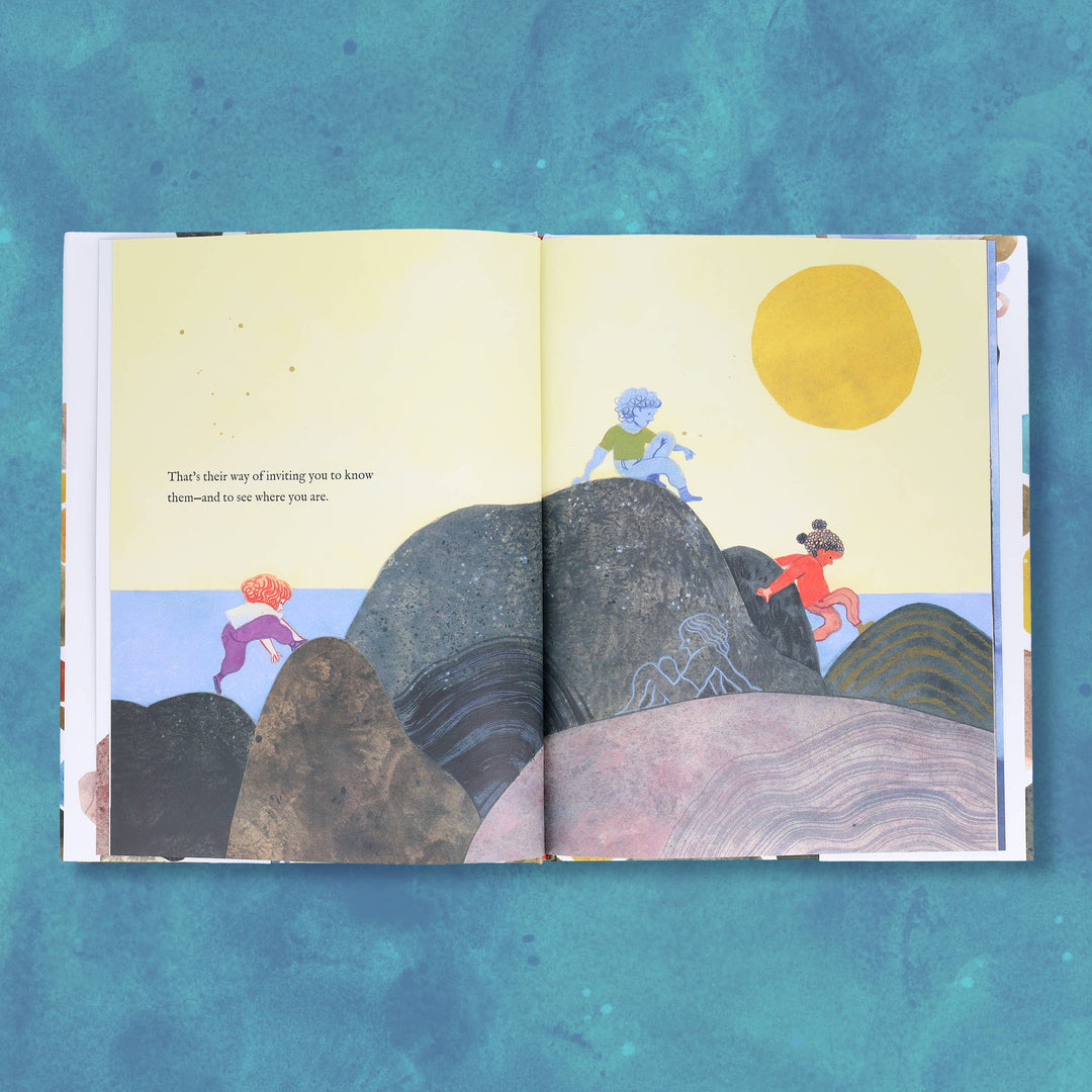 child sharing a favorite rock with a parent in an illustrated spread from this picture book