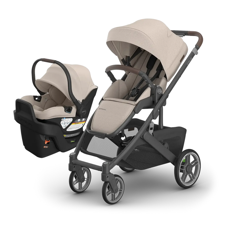 UPPAbaby Cruz V3 Ada with Aria V2 Ada — matching sandstone compact stroller and infant car seat travel system