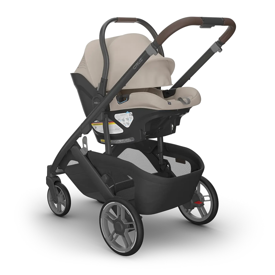 UPPAbaby Cruz V3 Ada with Aria V2 Ada angle — sandstone compact stroller travel system