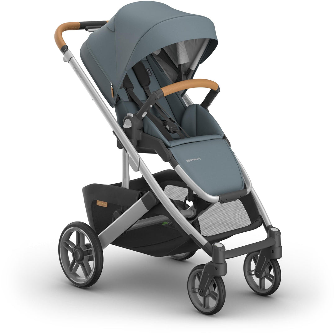 Right side angle of Uppababy Cruz V3 Stroller in Callum, showcasing lightweight stroller frame and durable wheels