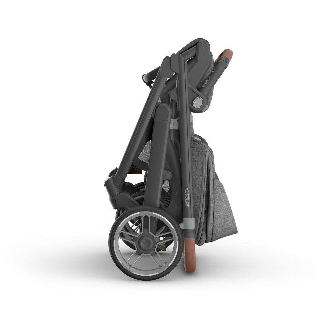 Folded Uppababy Cruz V3 Stroller in Greyson, displaying compact fold and easy one handed fold design