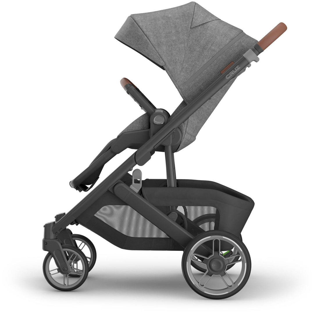 Full left side profile of Uppababy Cruz V3 Stroller Greyson, safe stroller built with comfort and style for city parents