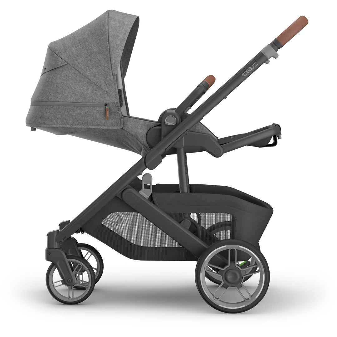 Side reversed reclined position of Uppababy stroller cruz v3 in Greyson, premium stroller with bassinet seat compatibility