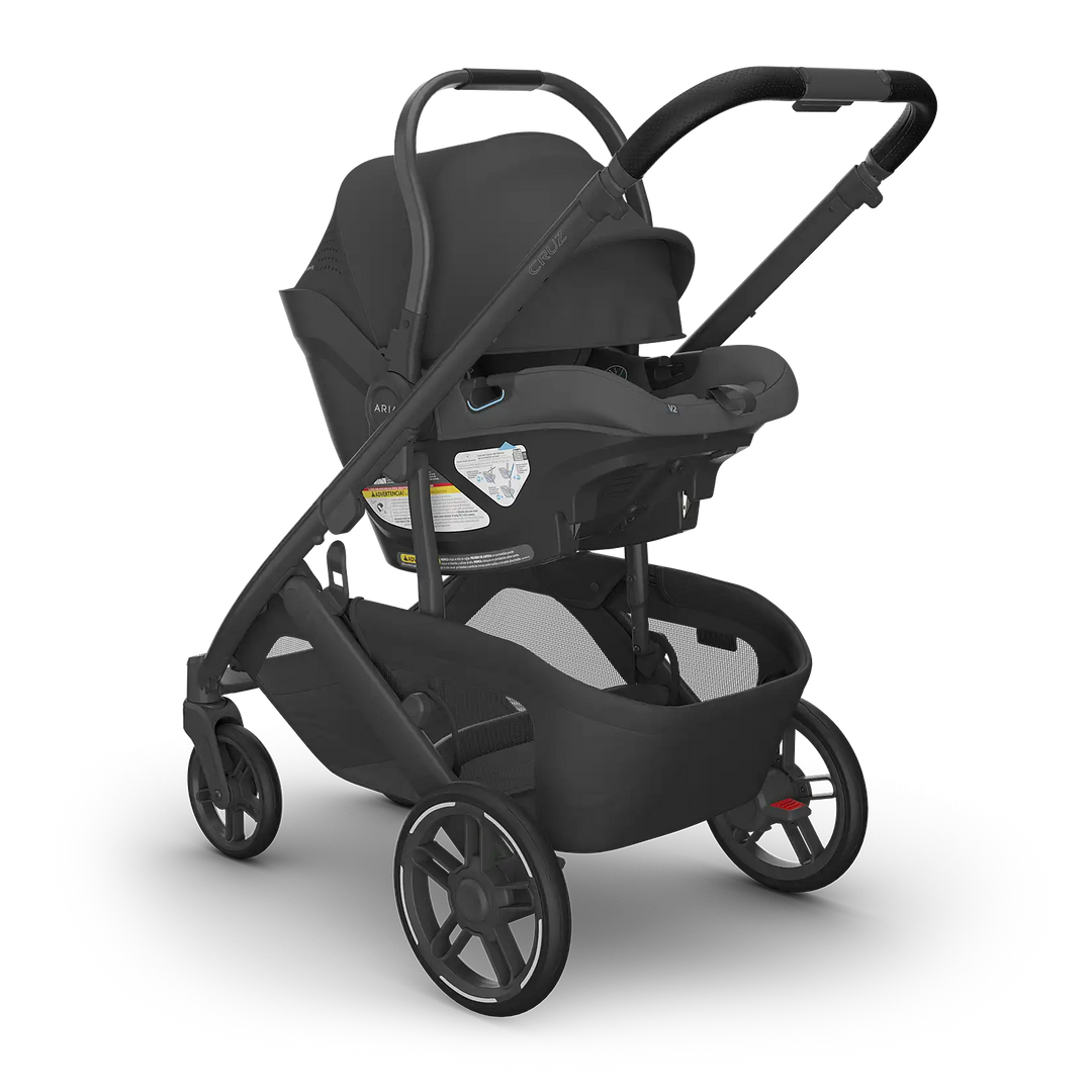 UPPAbaby Cruz V3 Jake with Aria V2 Jake angle — all-black compact stroller travel system