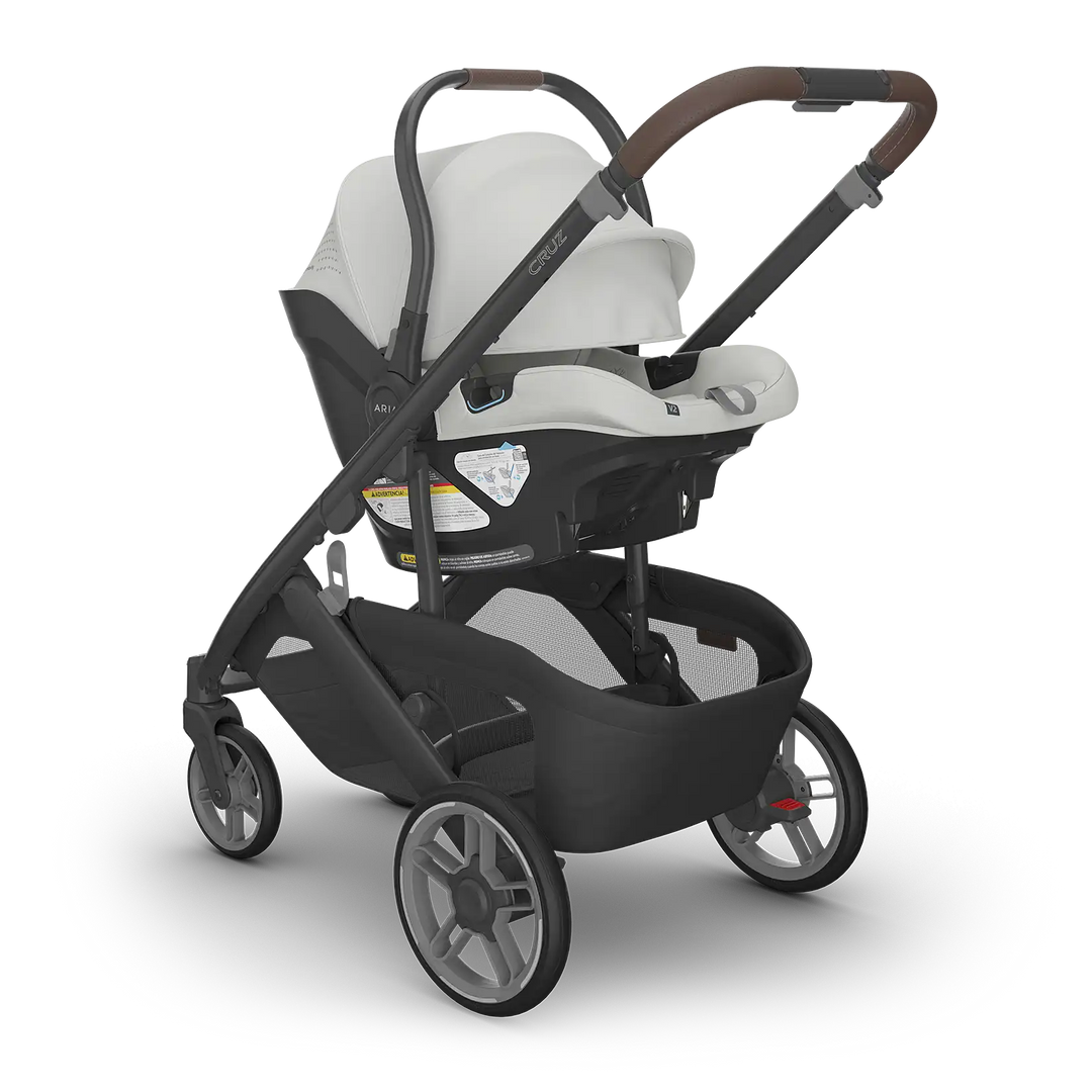 UPPAbaby Cruz V3 Savannah with Aria V2 Savannah angle — pearl gray compact stroller travel system