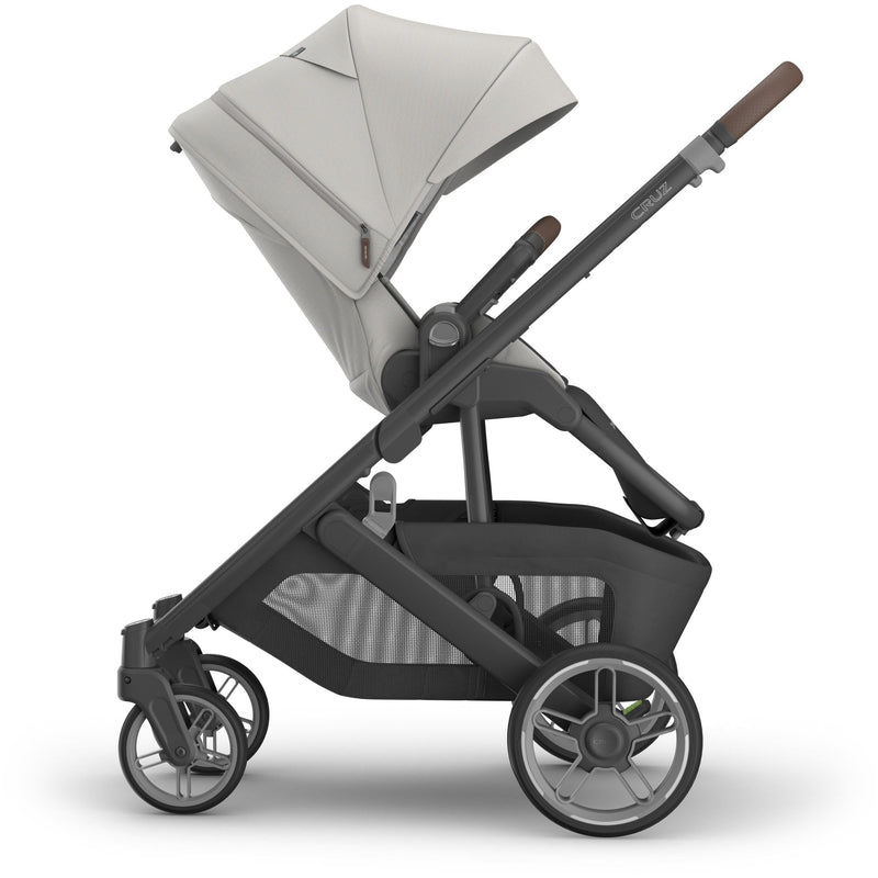 Reversed seat side view of Uppababy Cruz V3 Stroller Savannah, stroller with bassinet seat compatibility and sleek finish